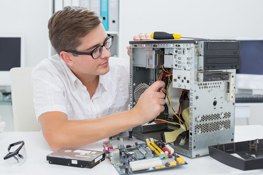 man repairing desktop 