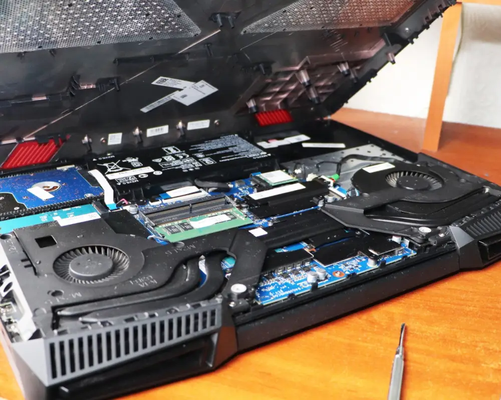 HP laptop repair in Dubai — technician repairing HP laptop